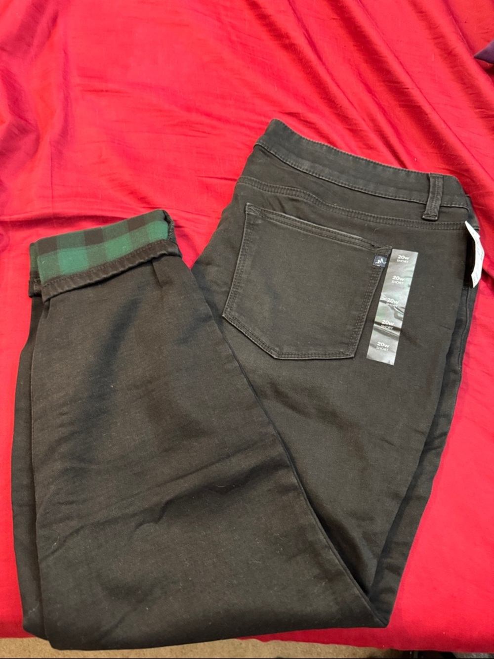 Maurice’s black stretch jeggings with green plaid cuff